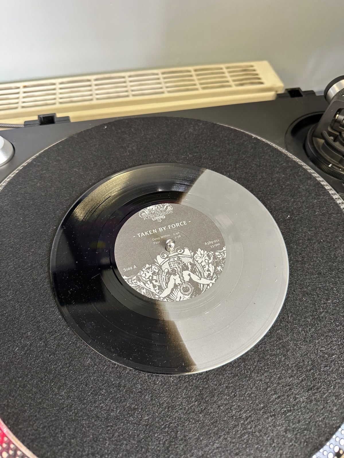 Taken By Force black and clear 7-inch vinyl